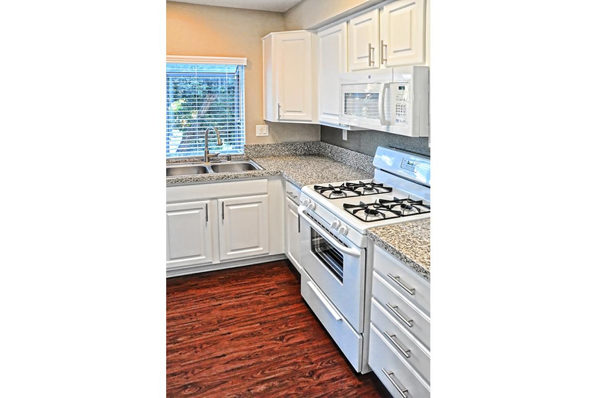 a kitchen with a stove top oven