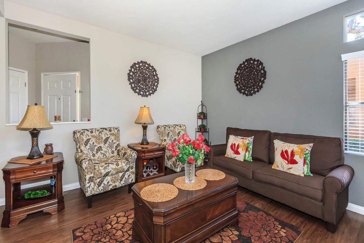 a living room filled with furniture and a fire place