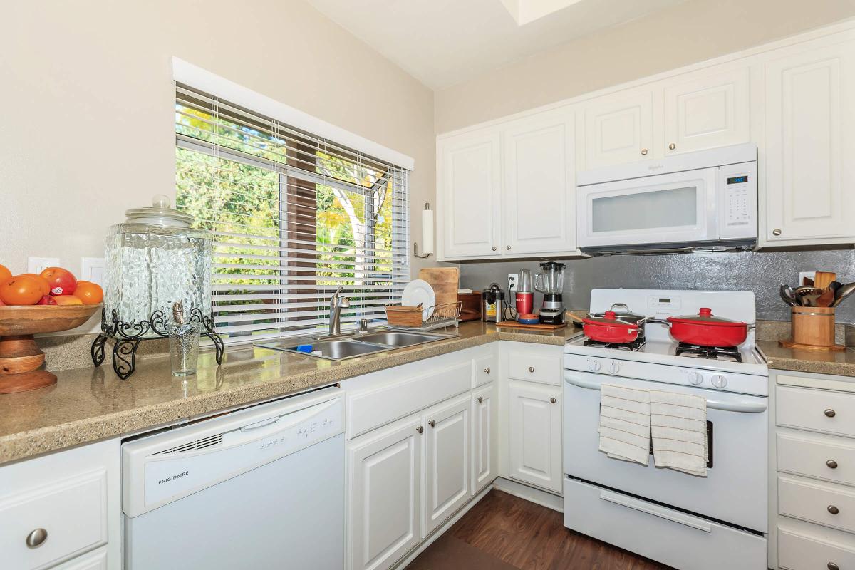 a kitchen with a stove and a sink