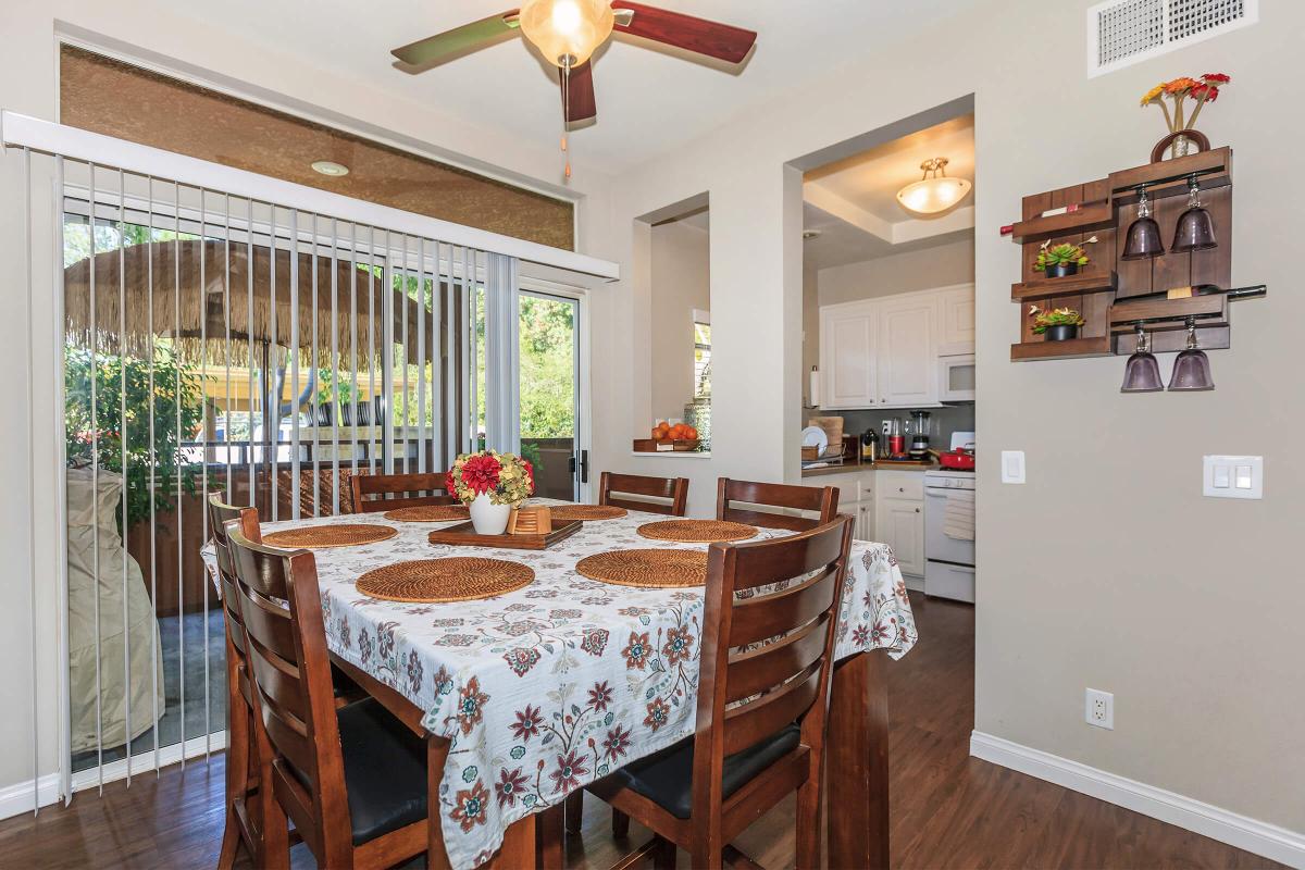 a dining room table in front of a window