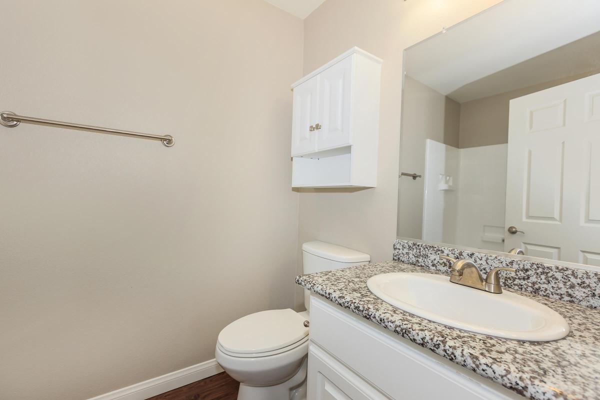 a large white tub next to a sink