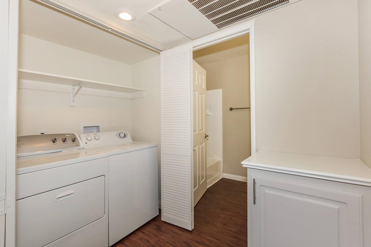 a white refrigerator freezer sitting inside of a kitchen