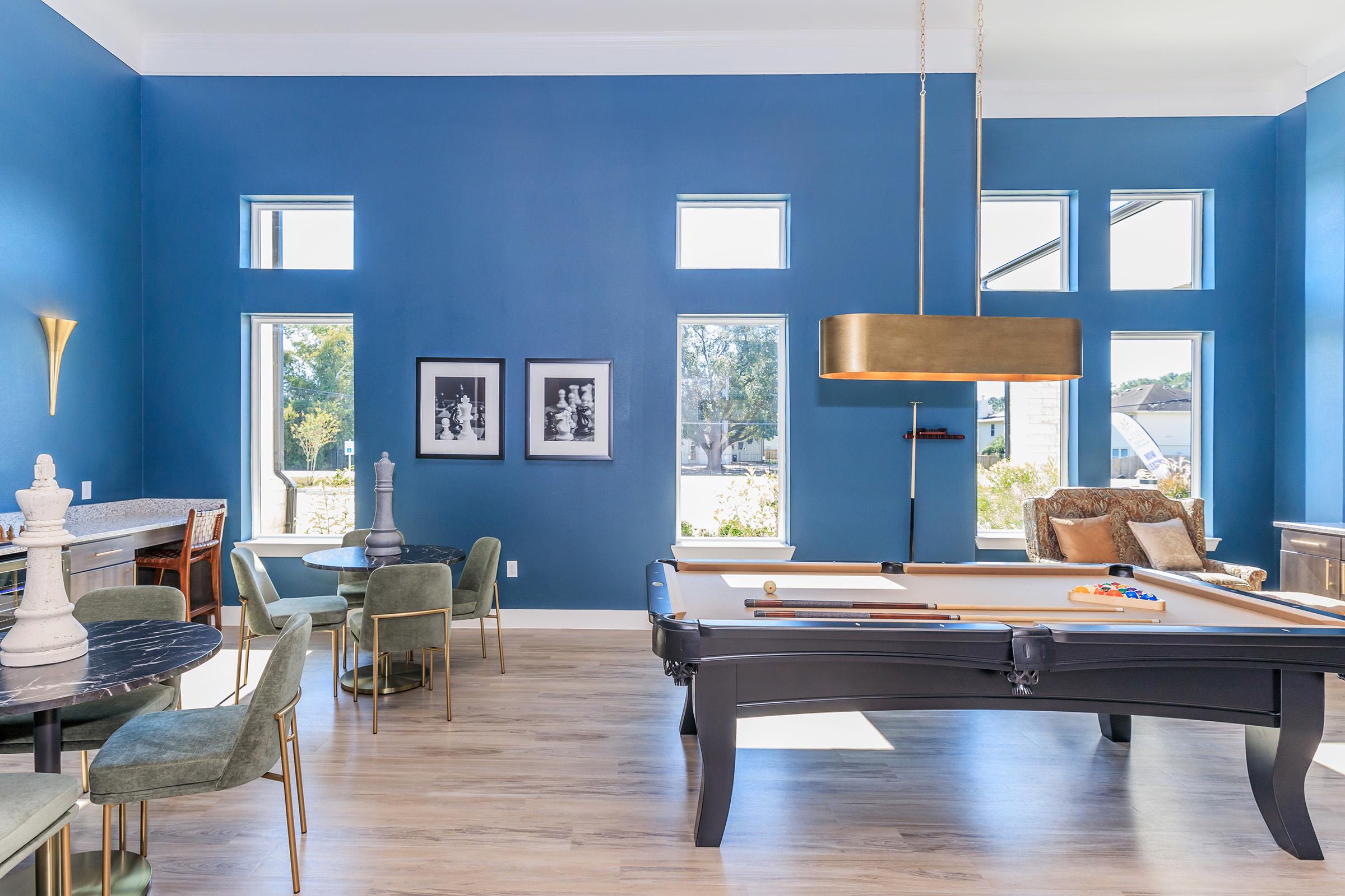 a living room filled with furniture and a large window