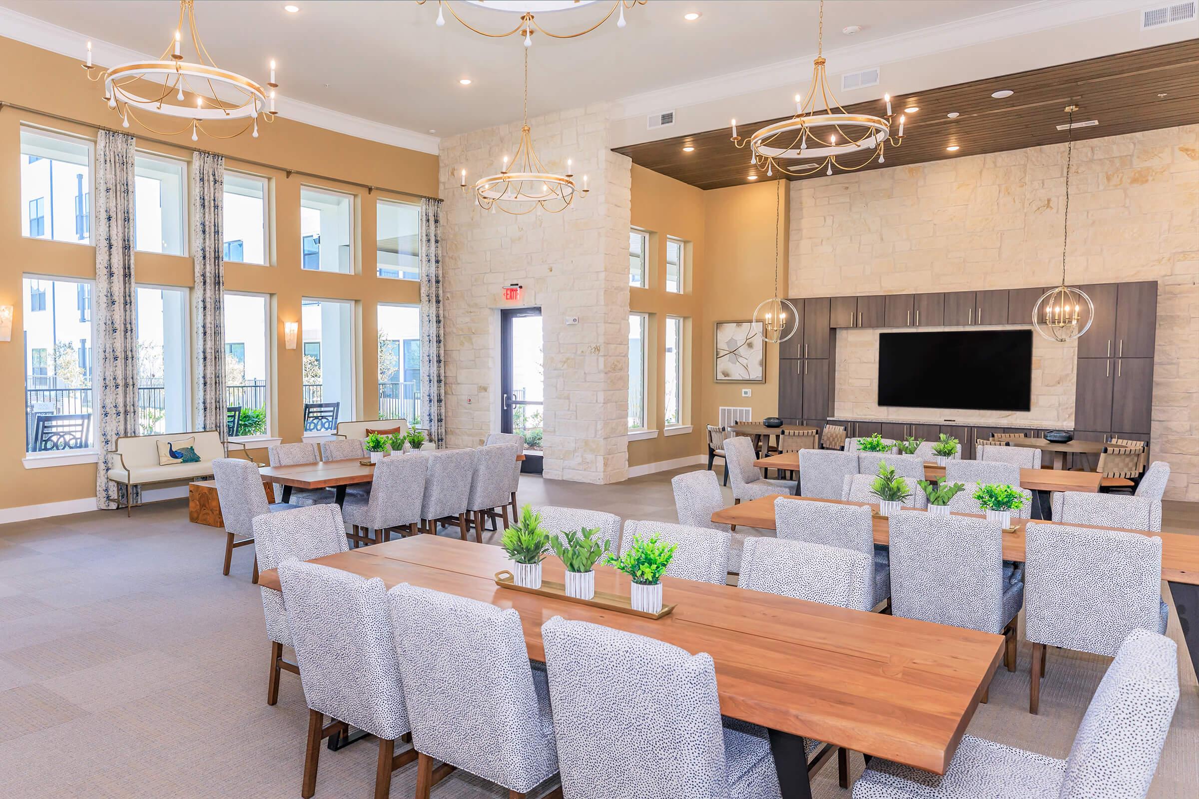 a room filled with furniture and a large window