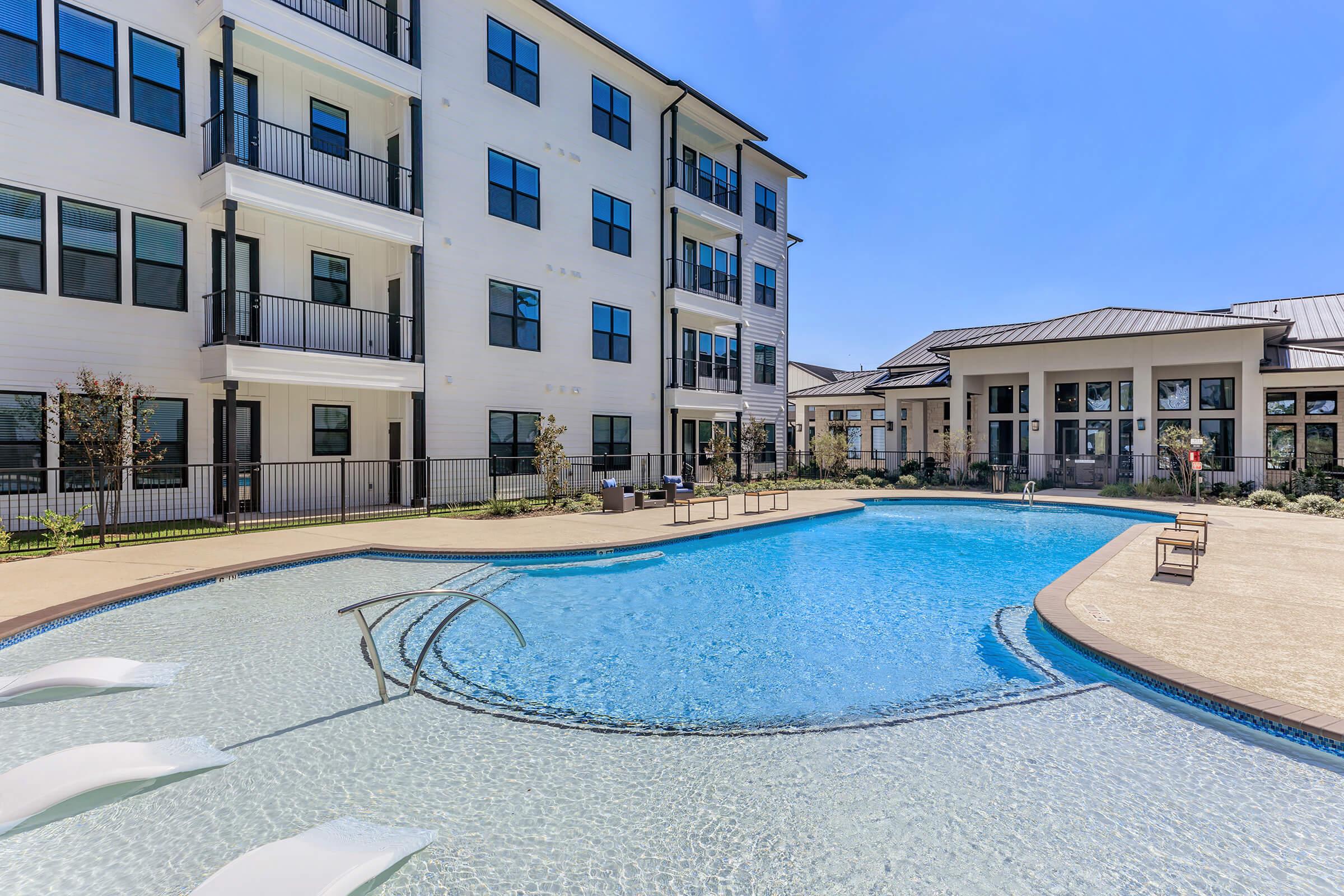 a pool next to a building