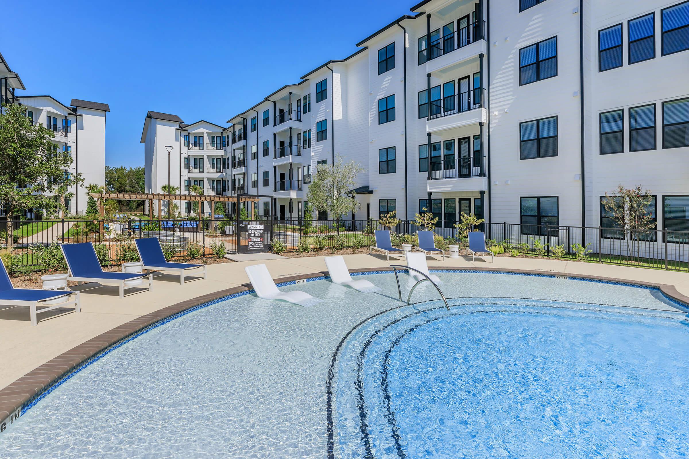 a pool next to a building