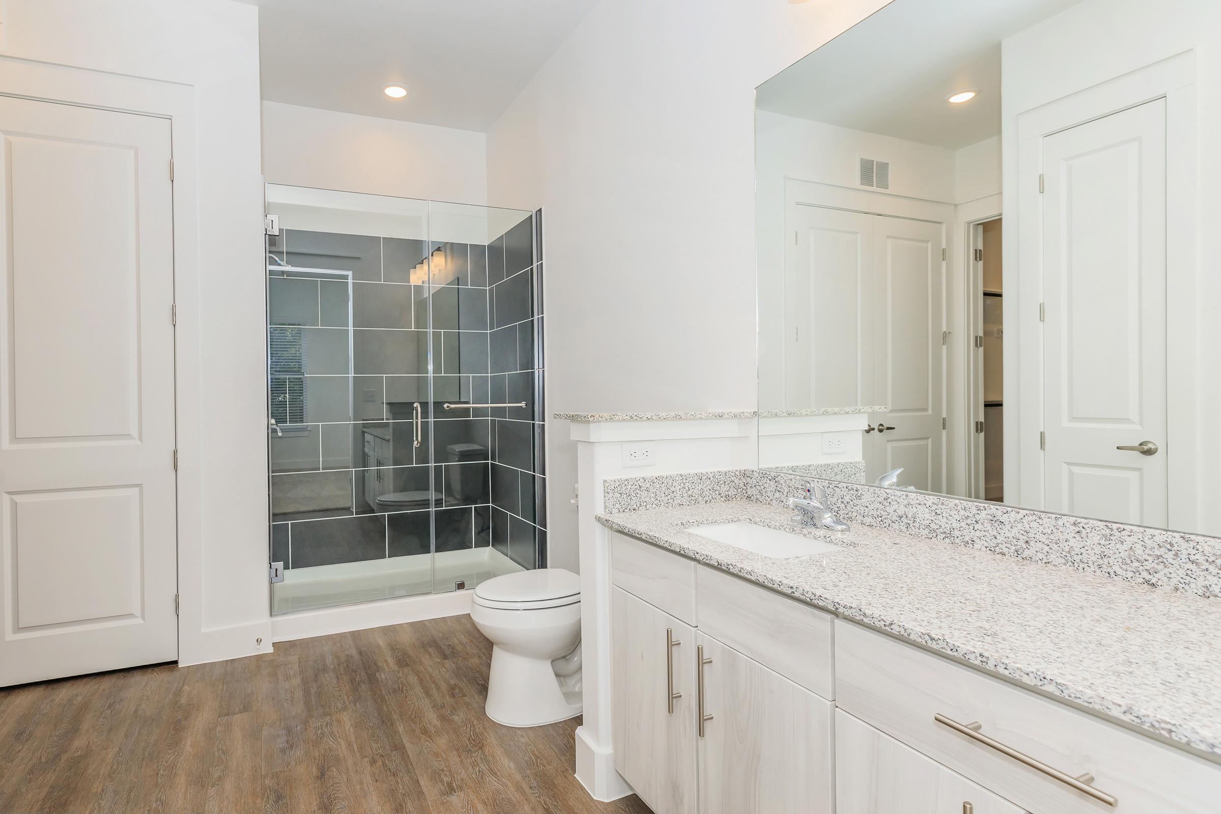 a kitchen with a sink and a mirror