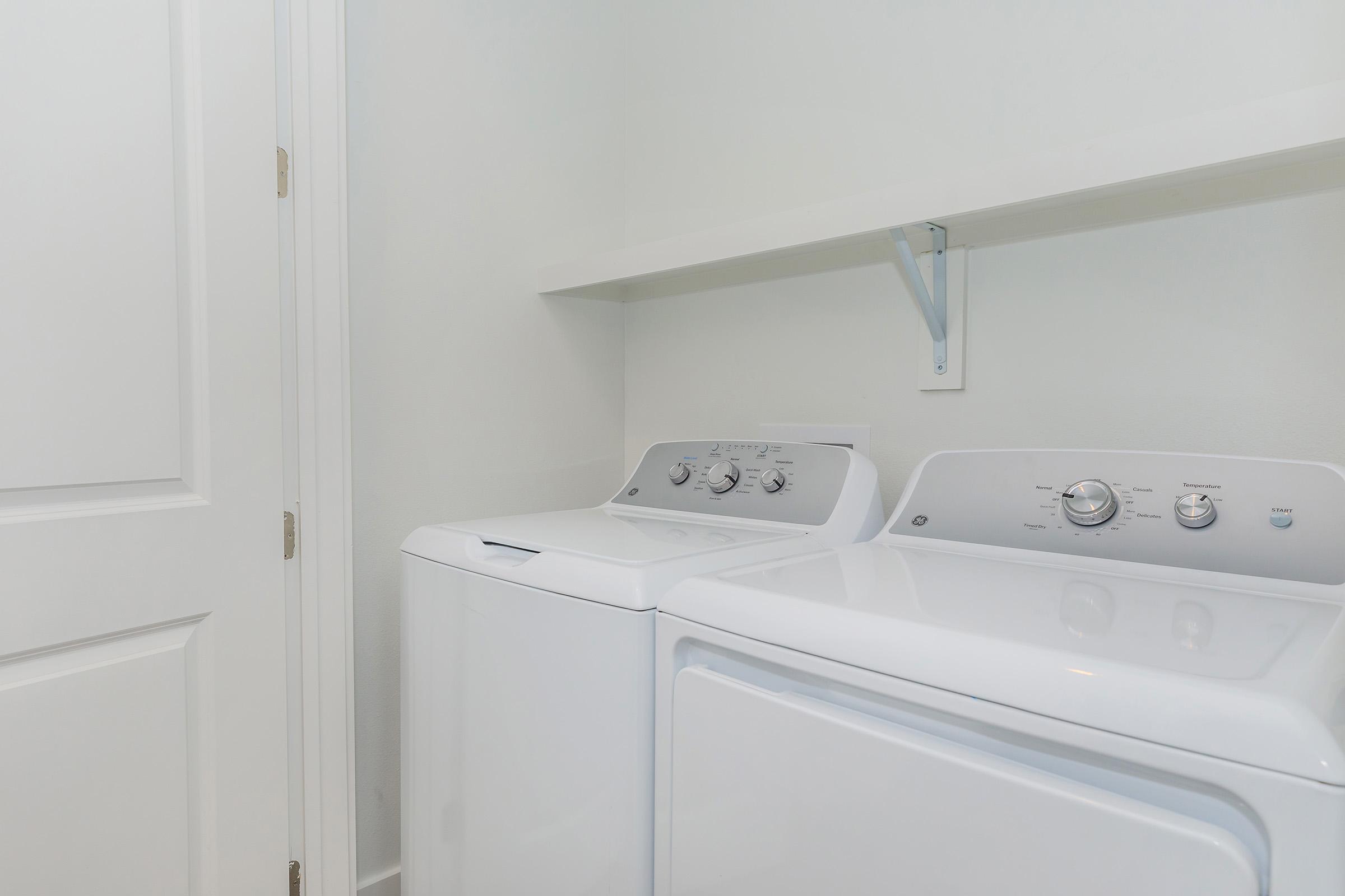 a kitchen with a sink and a mirror