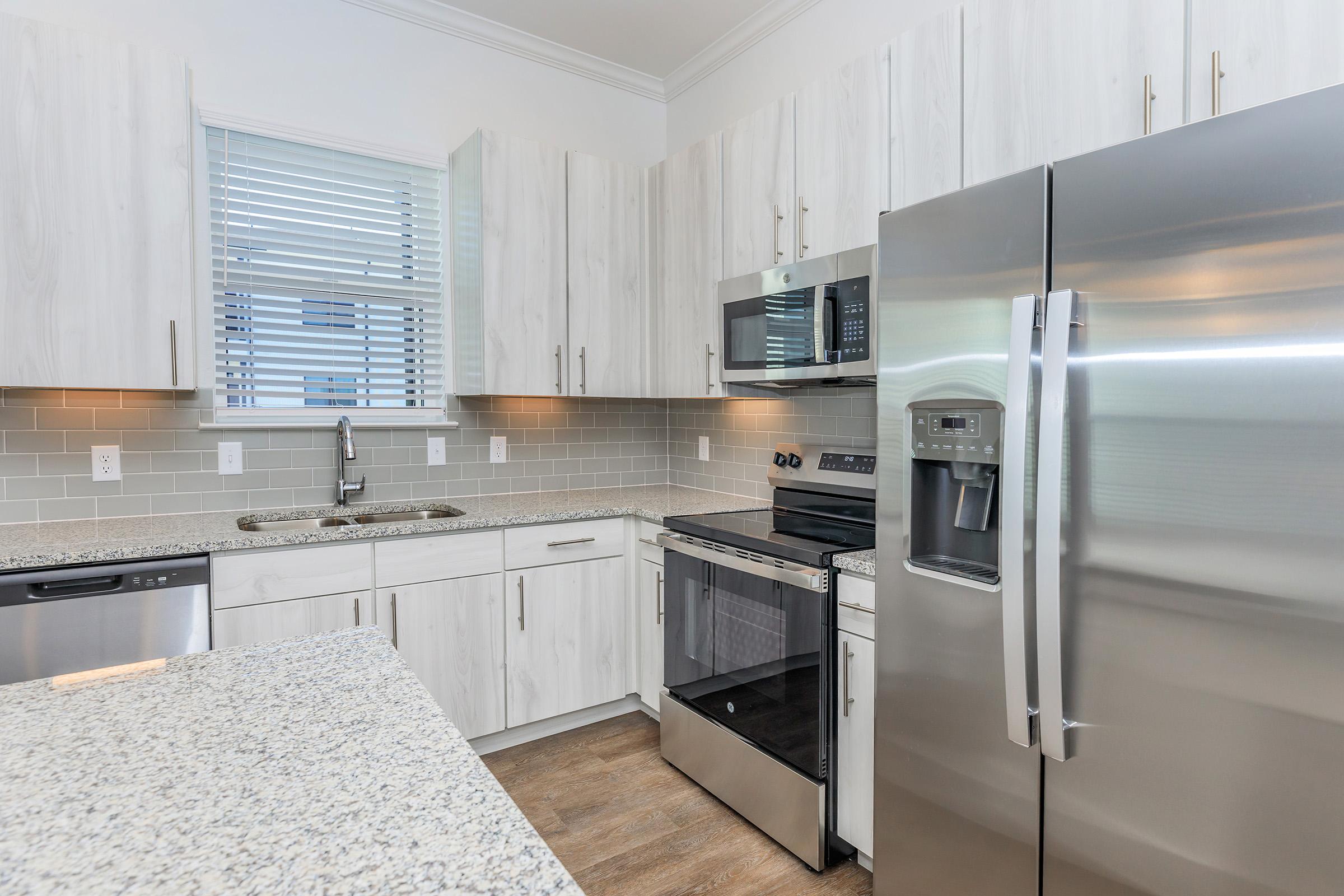 a modern kitchen with stainless steel appliances