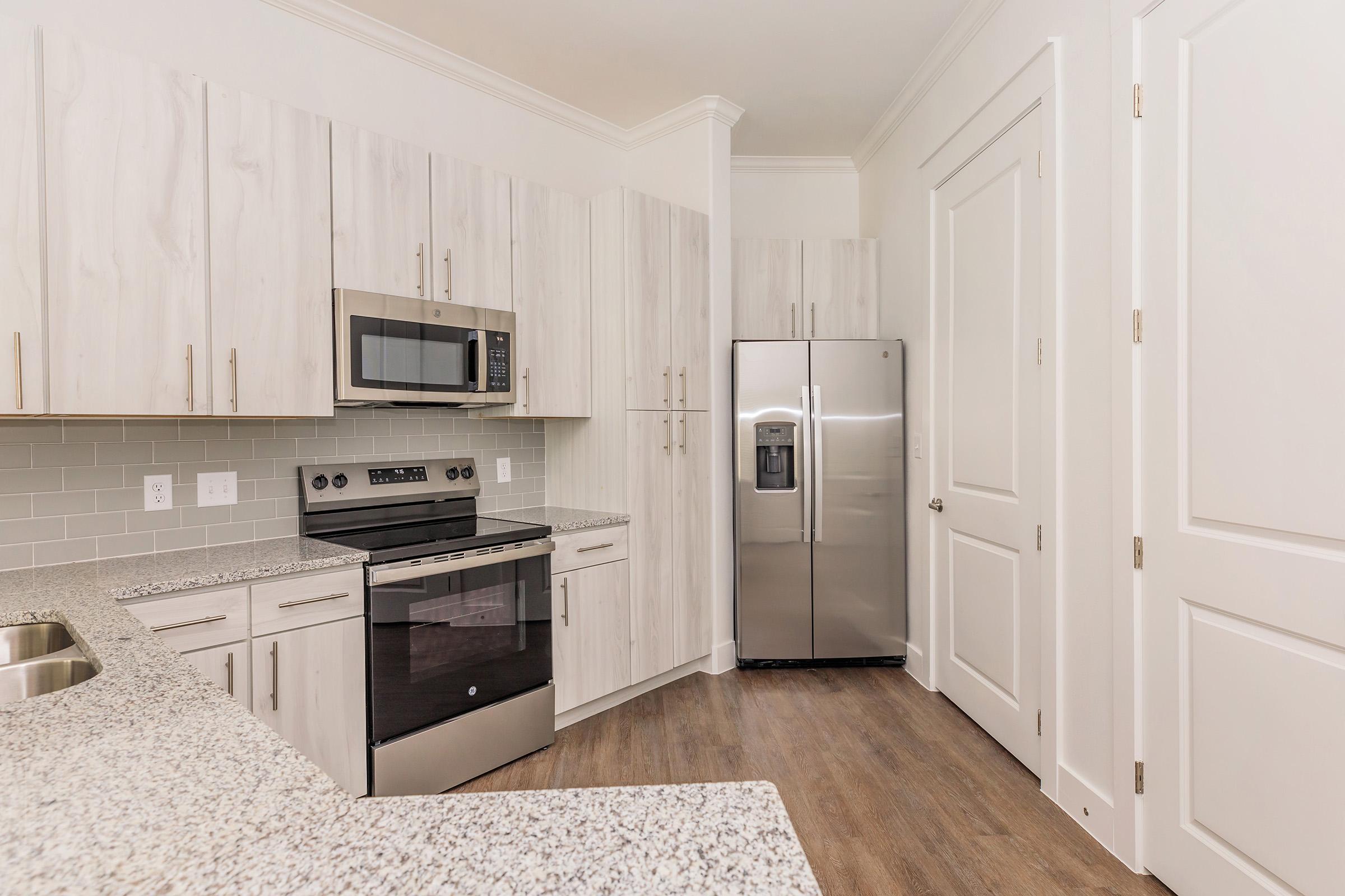 a kitchen with a sink and a microwave