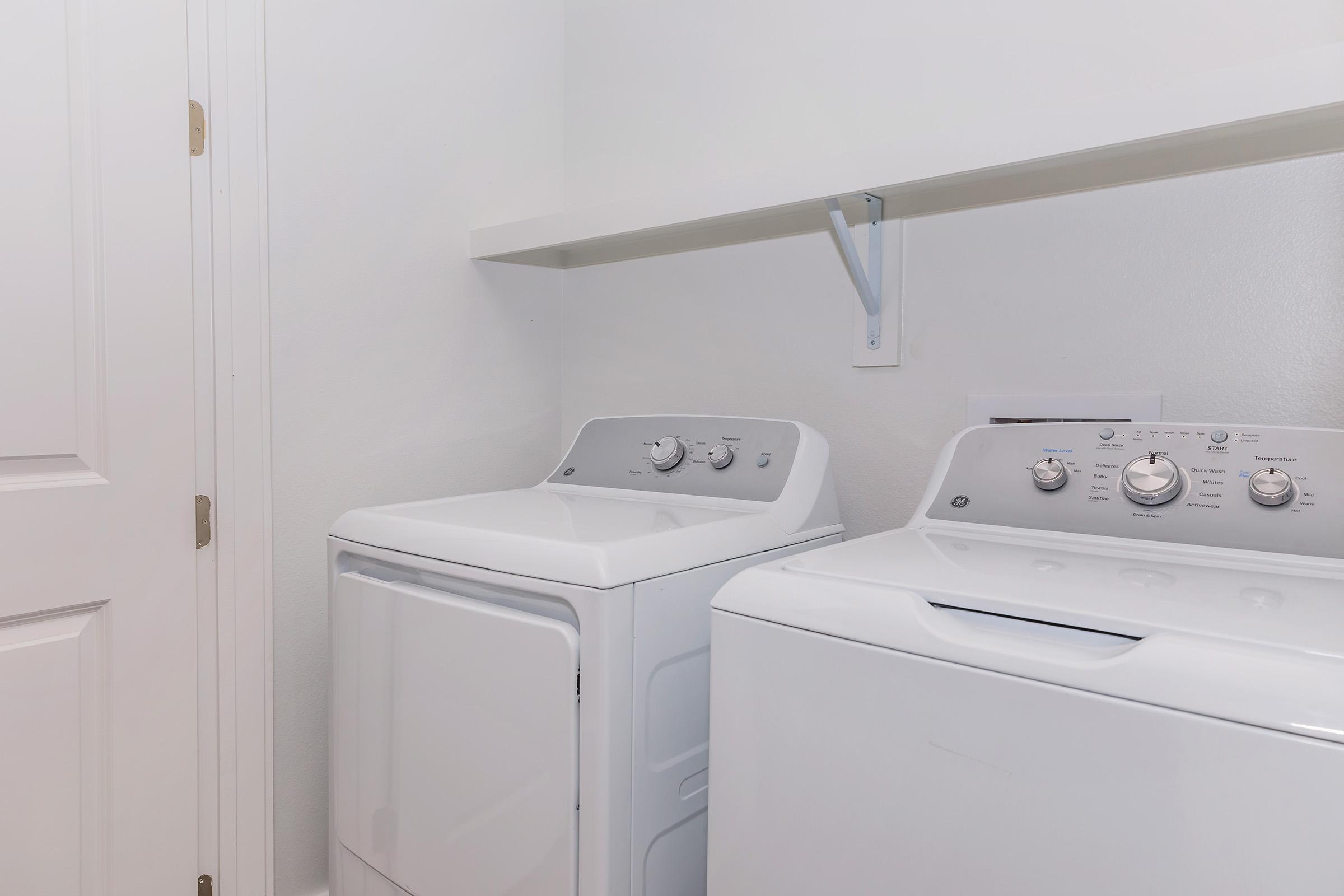 a kitchen with a sink and a refrigerator