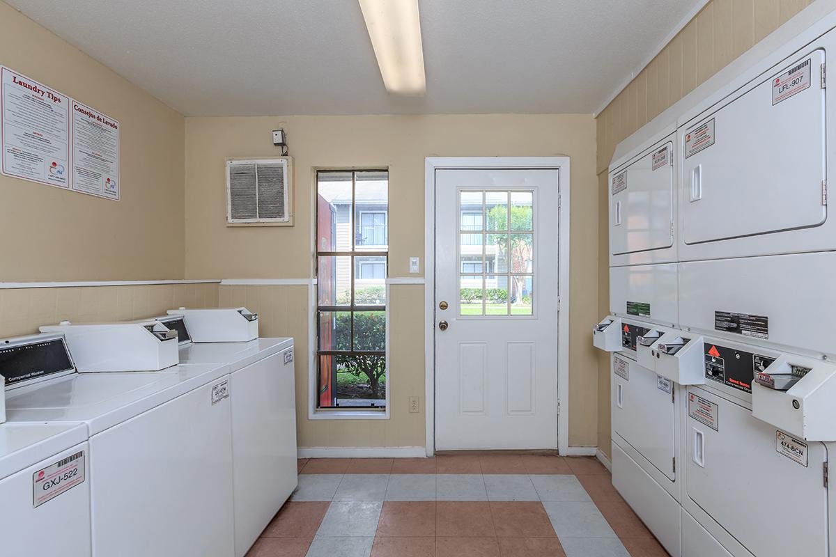 a large white refrigerator in a kitchen