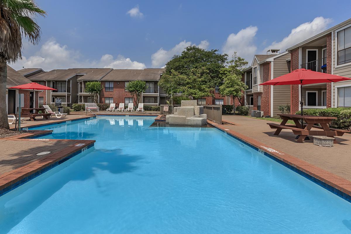 a house with a pool outside of a building