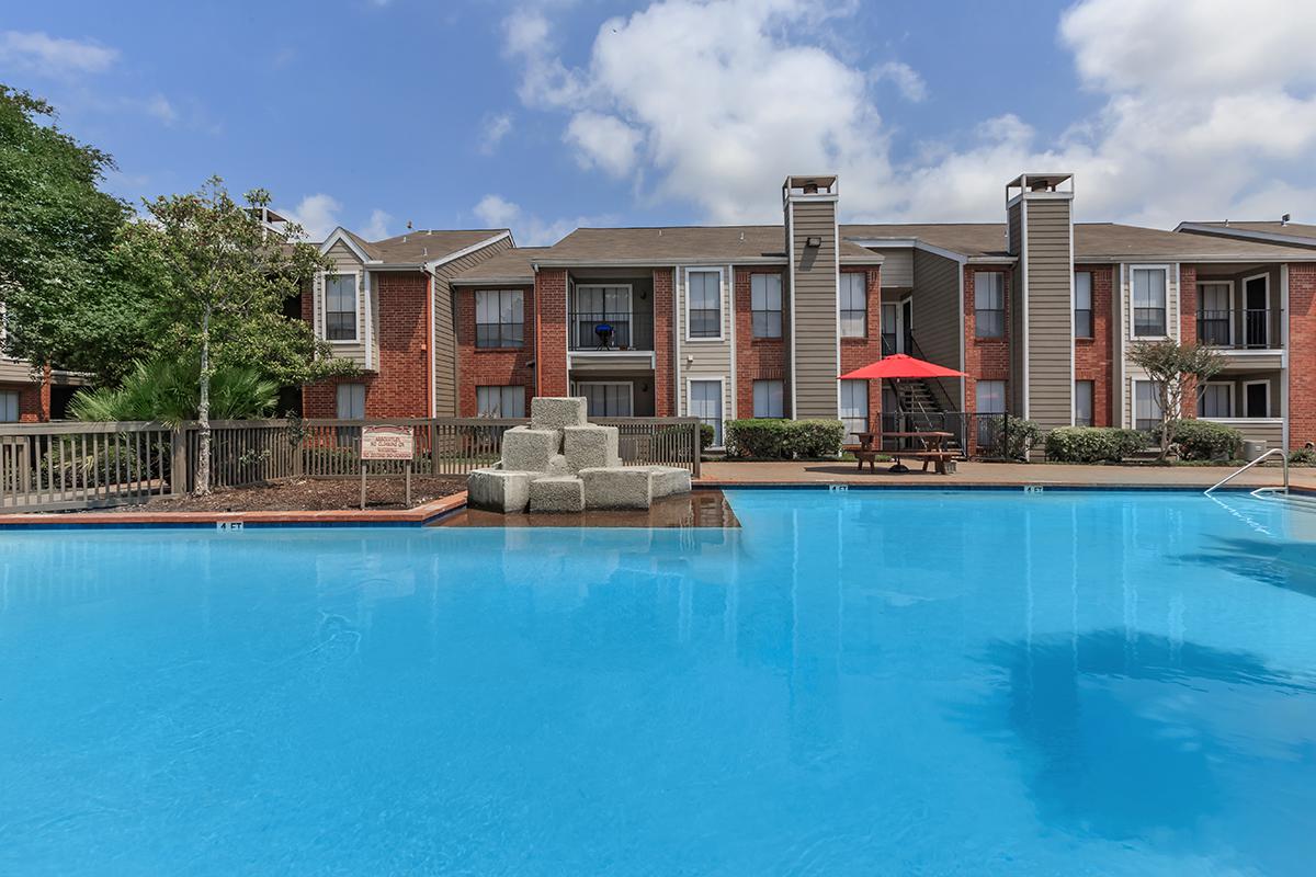 a large pool of water in front of a building