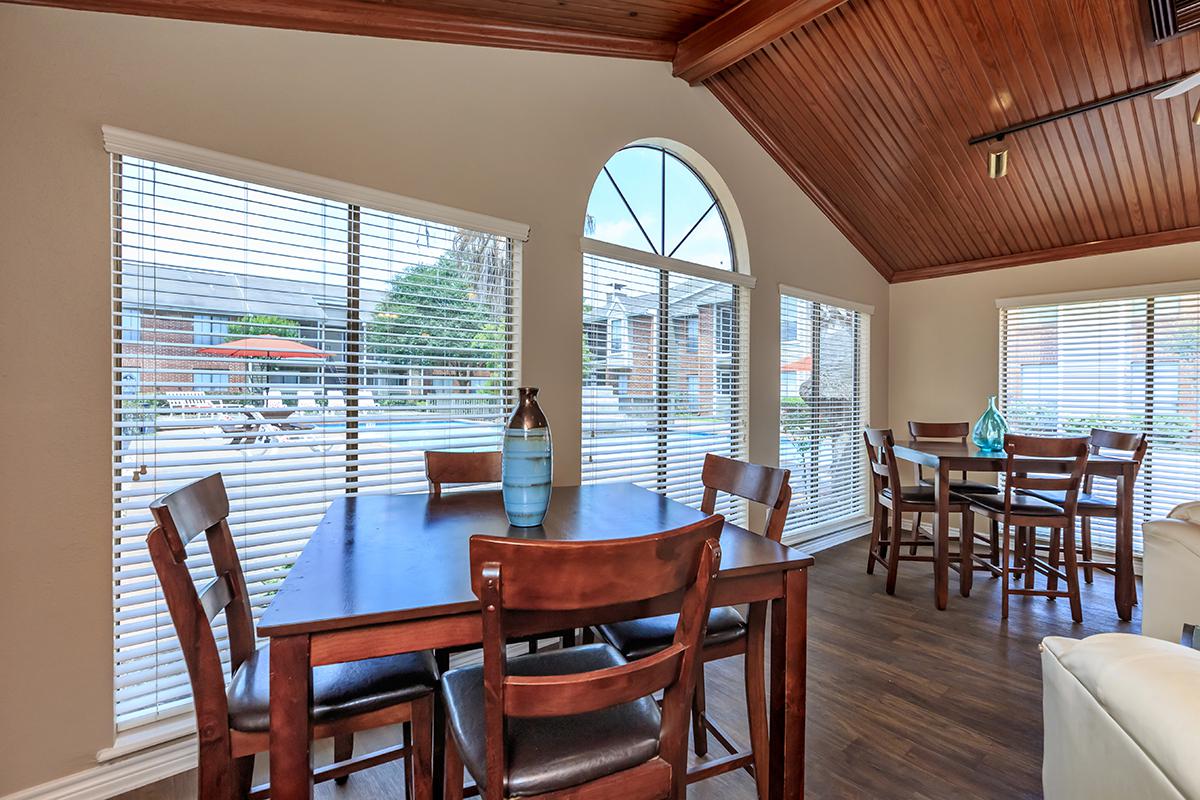 a dining room table in front of a window