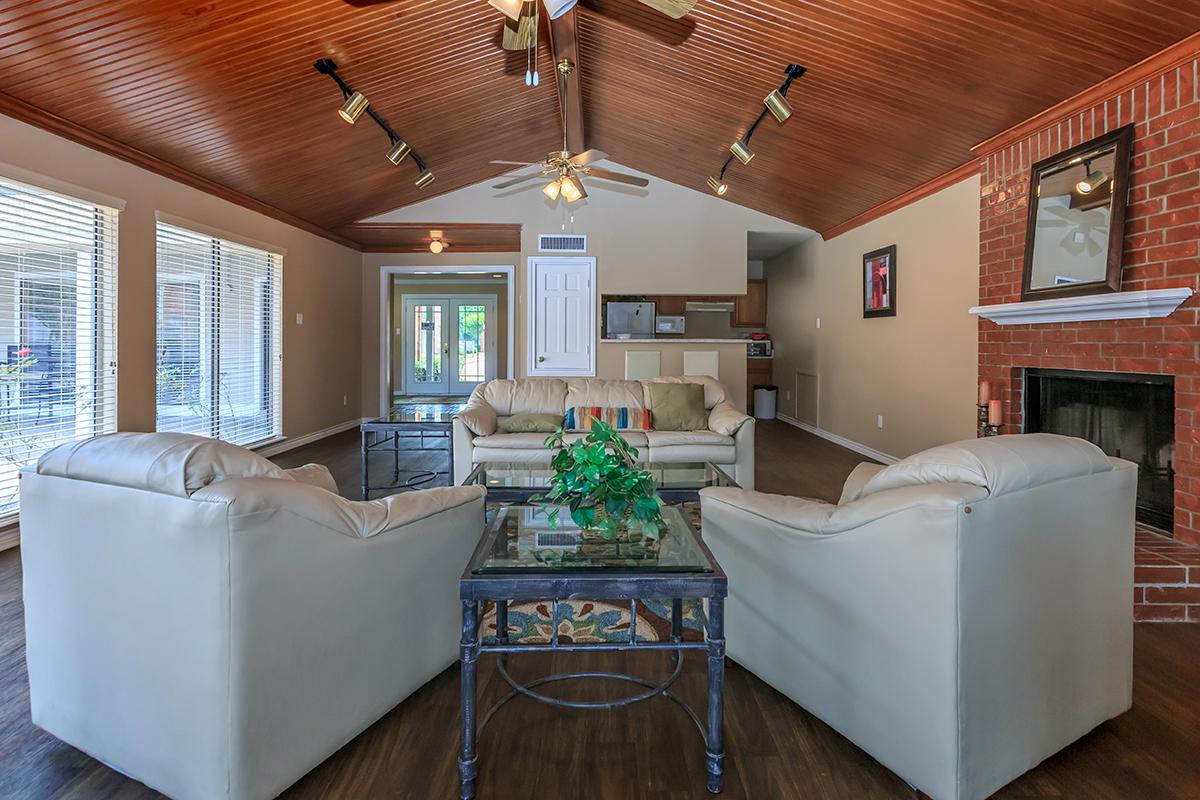 a room filled with furniture and a large window