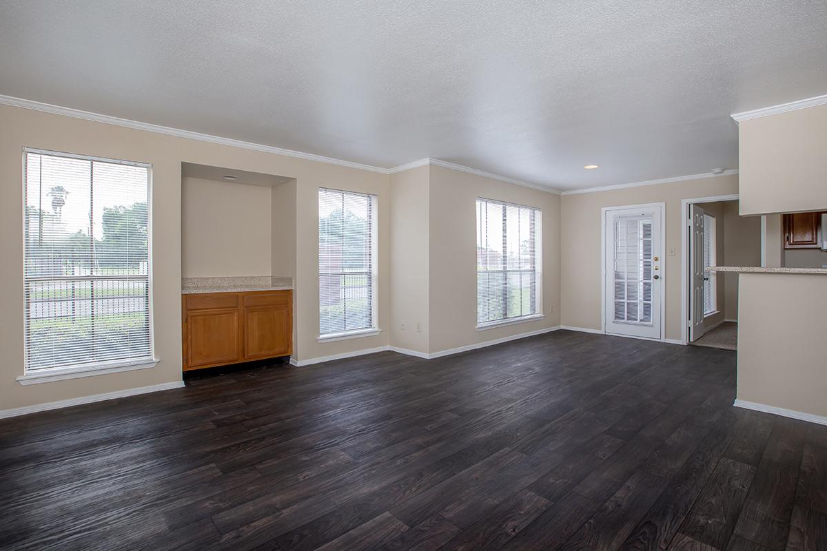 a room filled with furniture and a large window