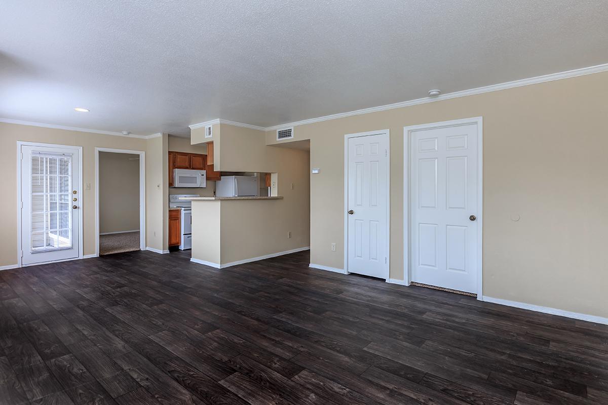 a large empty room with a wooden floor