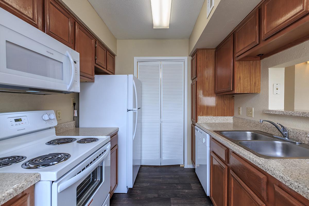 a kitchen with a stove top oven