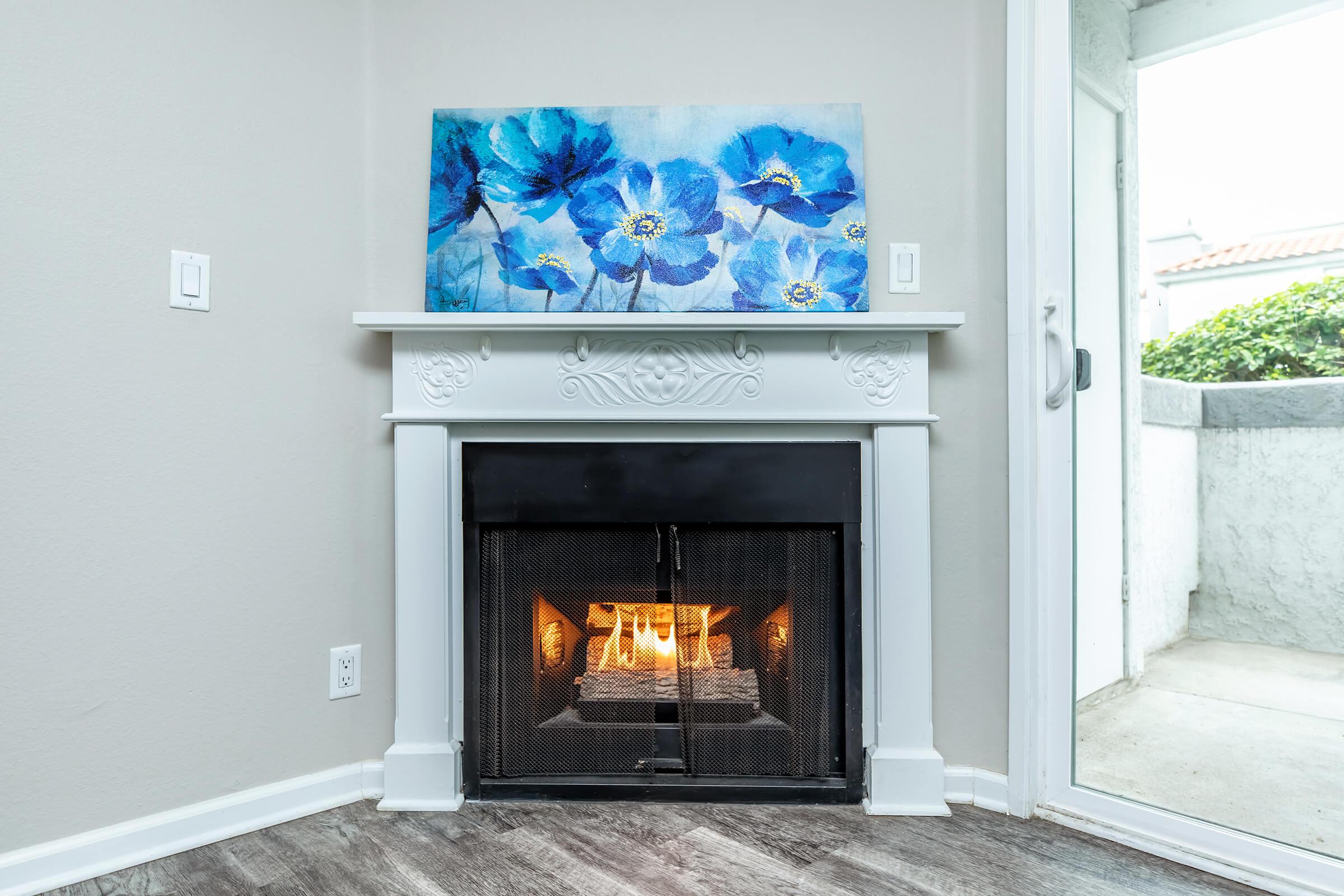 a stove top oven sitting next to a fireplace