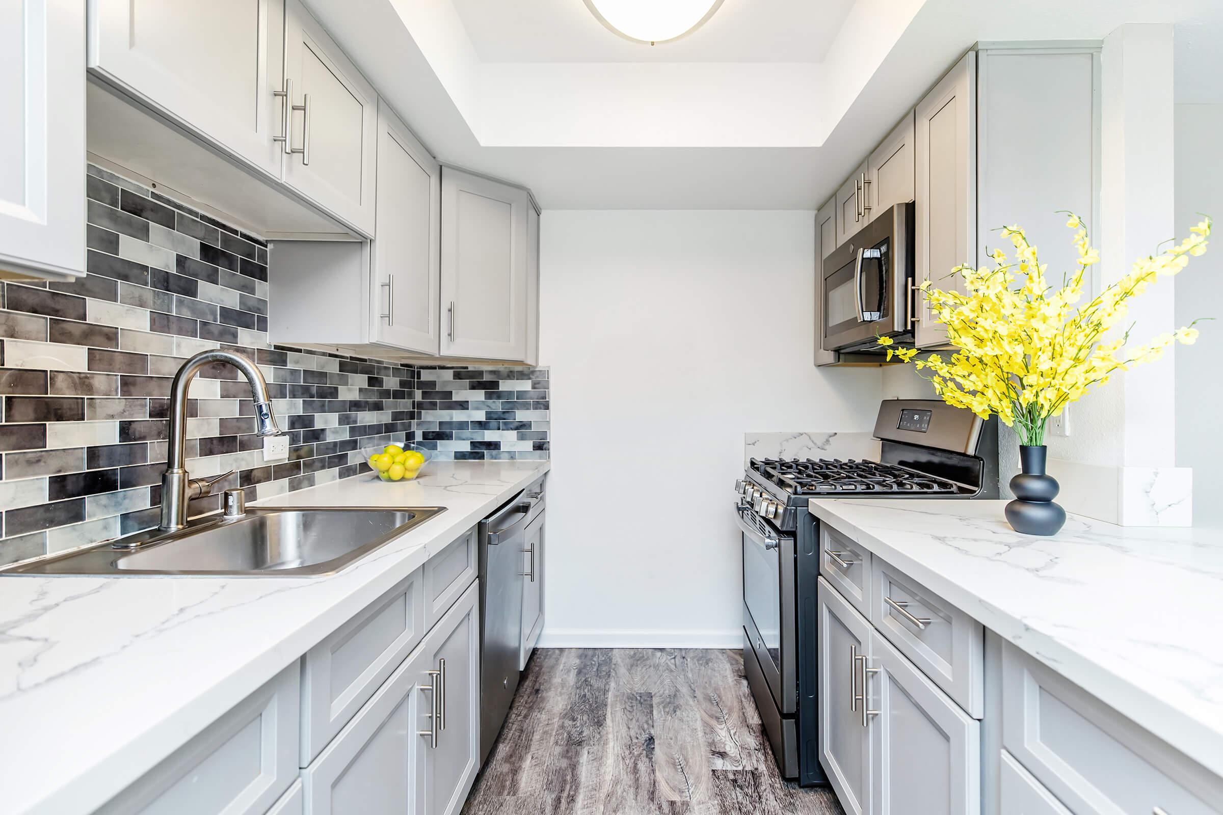 a kitchen with a sink and a window