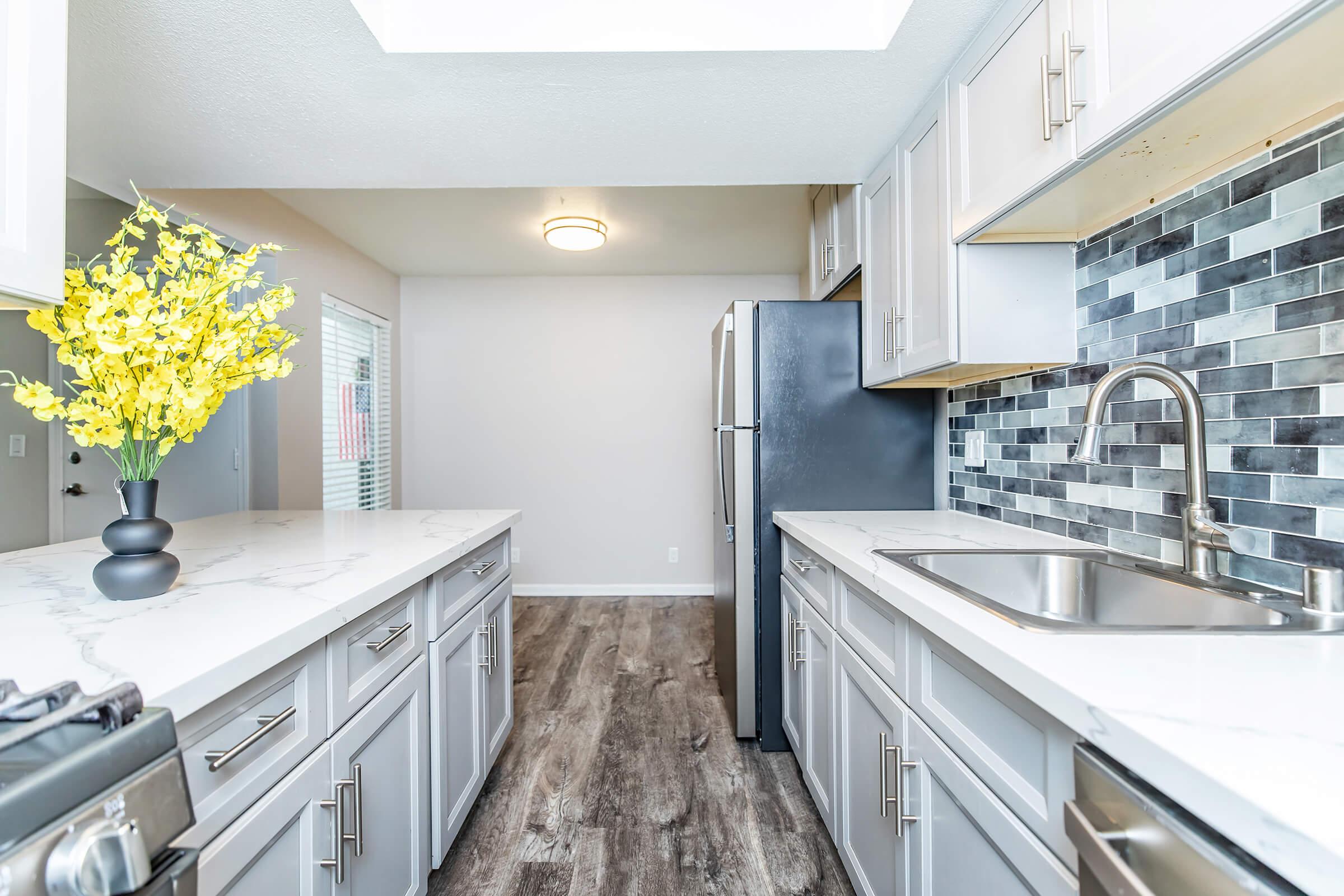 a large kitchen with stainless steel appliances