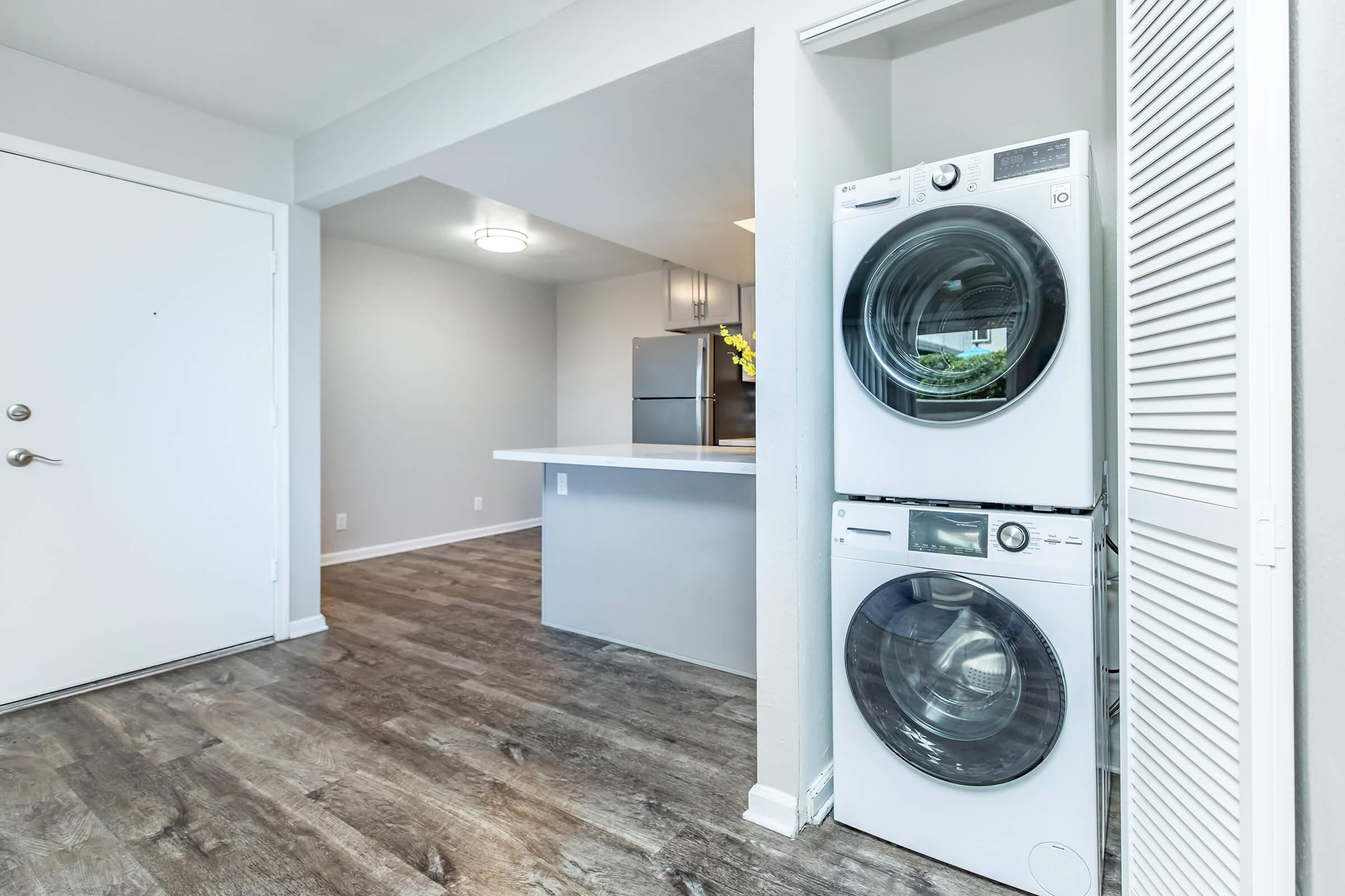 a kitchen with a refrigerator and a microwave