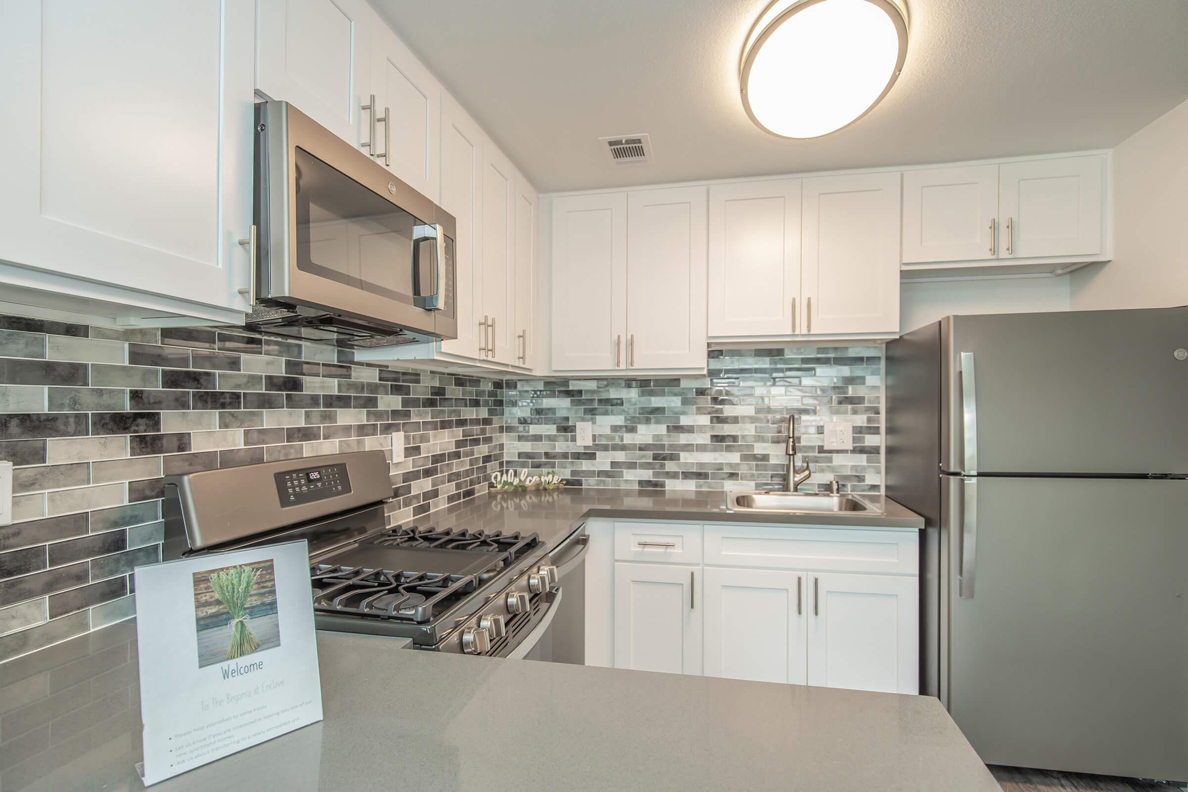 a kitchen with a stove top oven sitting inside of a refrigerator