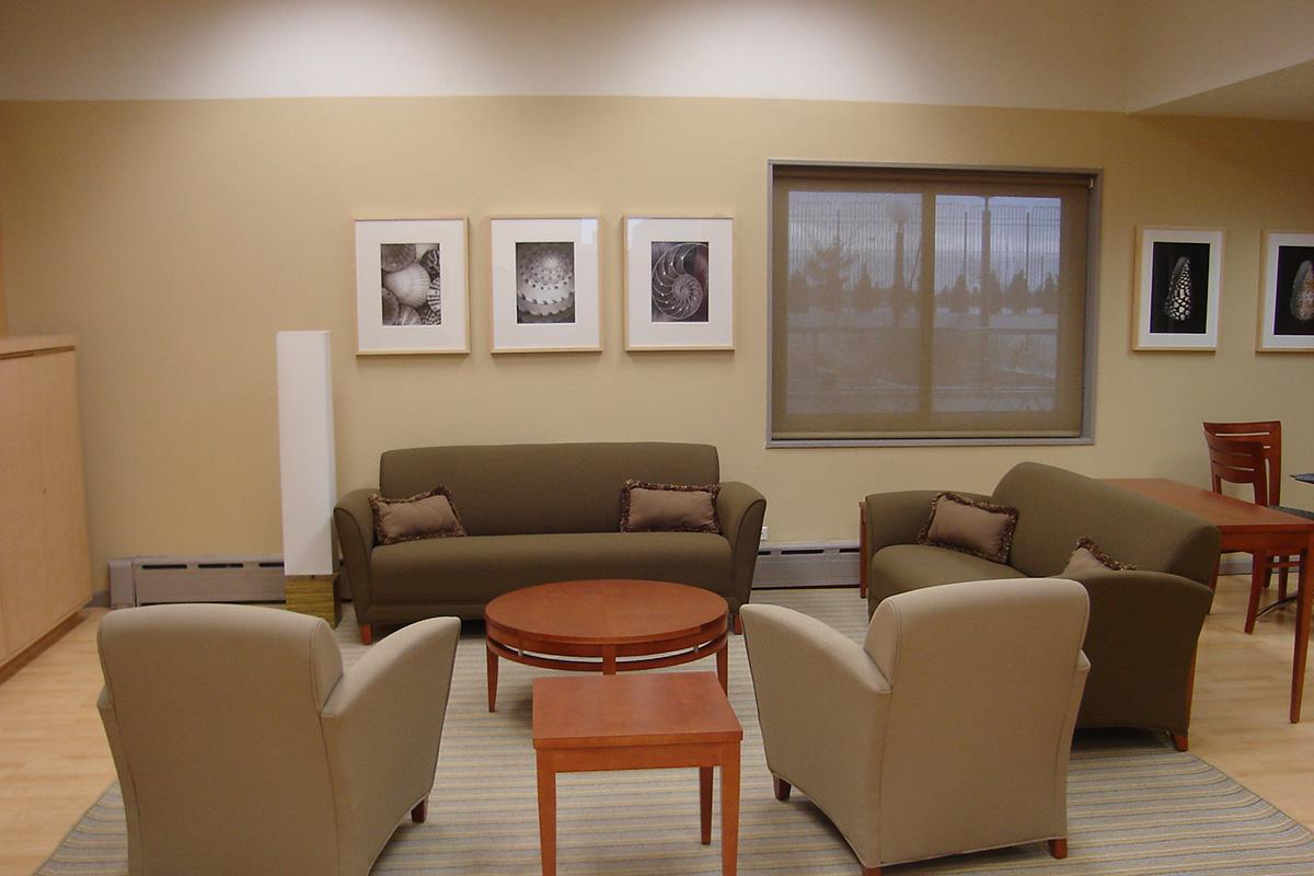 a living room filled with furniture and a table