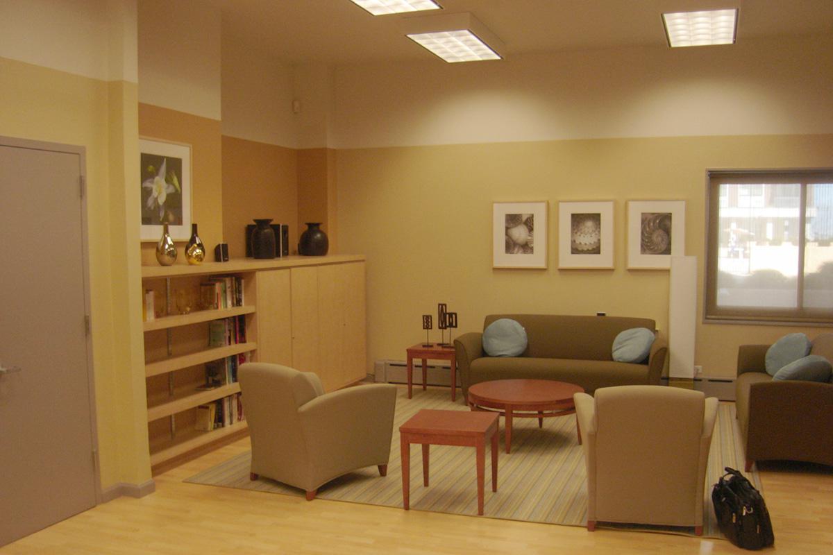 a living room filled with furniture and a large window