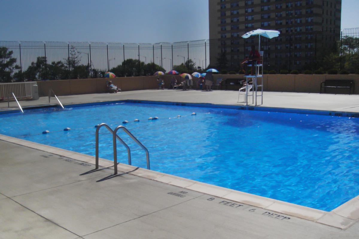 a pool next to a body of water