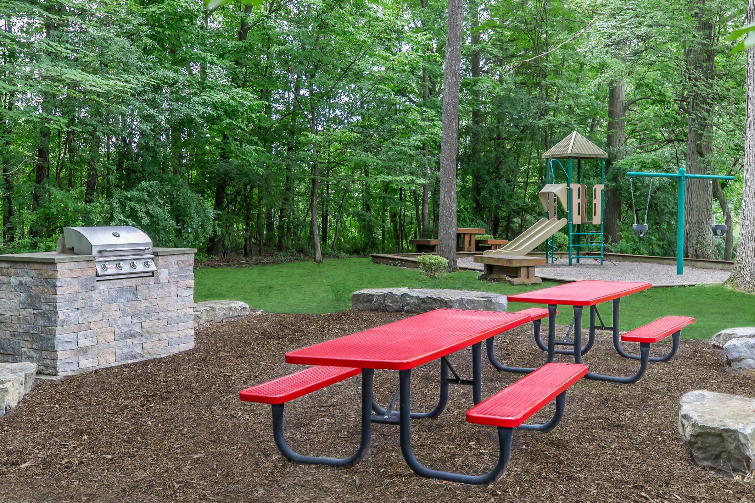 a group of lawn chairs sitting on top of a picnic table