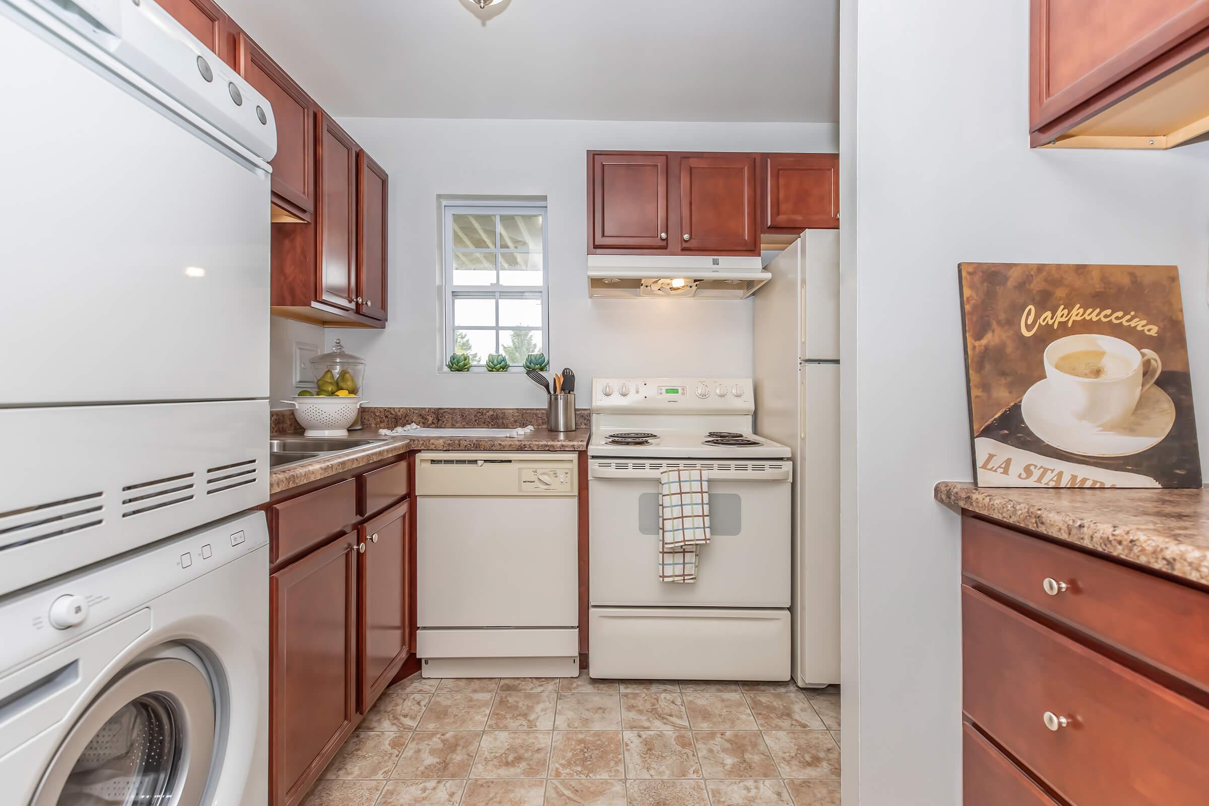 a kitchen with a sink and a refrigerator