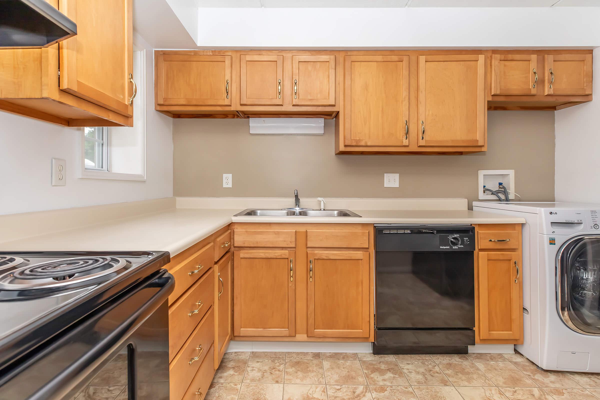 a stove top oven sitting inside of a kitchen