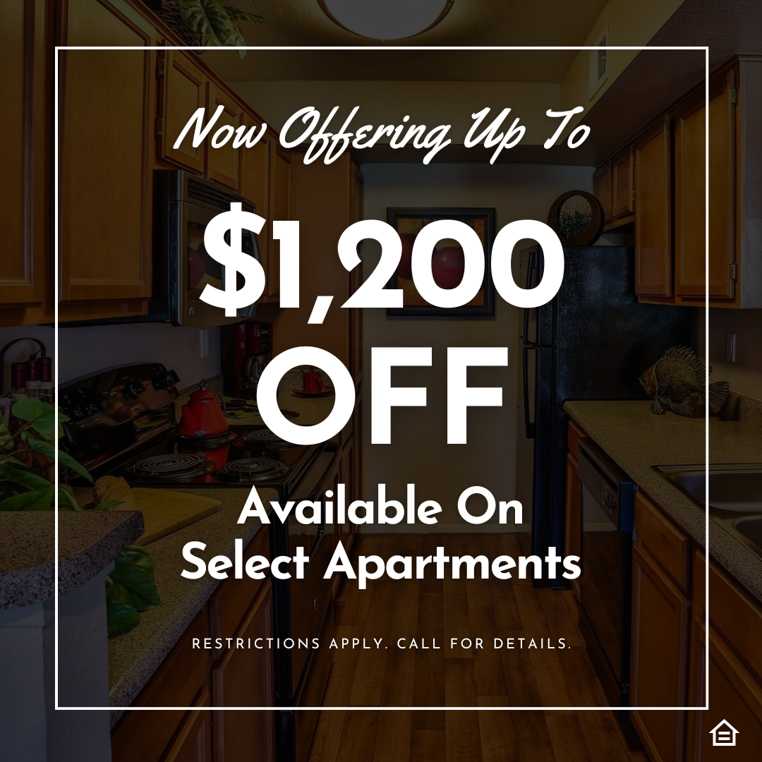 Promotional graphic showing a kitchen background with text overlay that reads: “Now Offering Up To $1,200 OFF Available On Select Apartments. Restrictions apply. Call for details.”