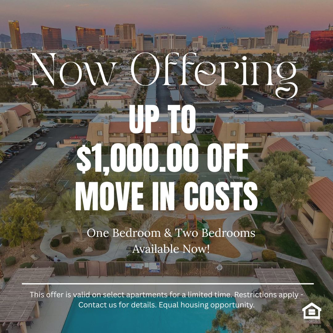 Aerial view of a suburban neighborhood with a basketball court and playground area in the foreground contrasted against the Las Vegas skyline in the background The cityscape features iconic buildings illuminated by sunset hues with palm trees and residential complexes visible below text reads now offering up to $1000 off move in costs one bedroom and two bedrooms available now This offer is valid on select apartments for a limited time Restrictions apply Contact us for details Equal housing opportunity