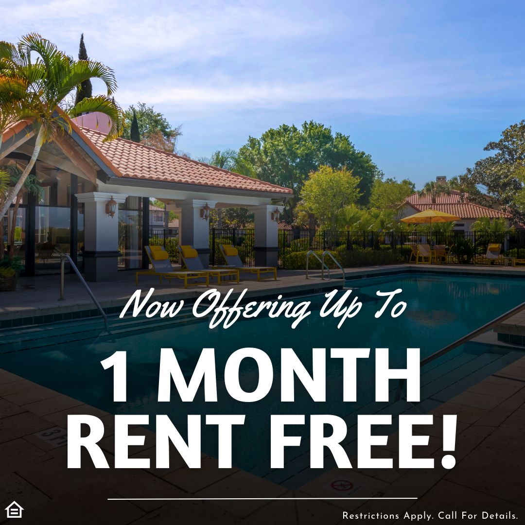 Picture of an apartment community pool with palm trees and seating. Text saying "Now offering up to 1 month rent free! Restrictions apply. Call for details.