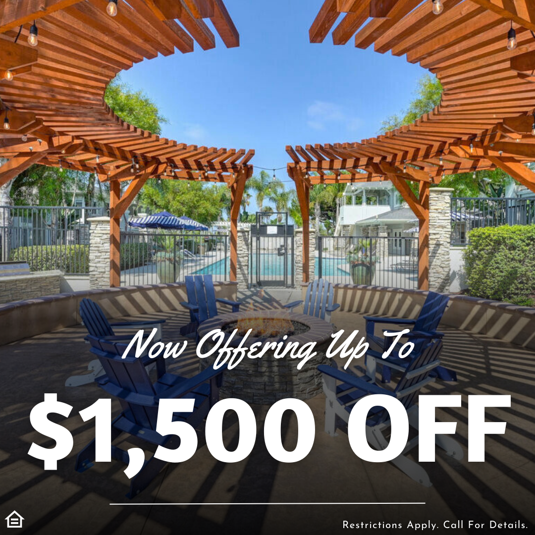 Outdoor community seating area with wooden pergolas and a round fire pit surrounded by blue Adirondack chairs, with a pool and palm trees in the background. Overlaid text reads: “Now Offering Up To $1,500 OFF.” Small print at the bottom states: “Restrictions Apply. Call For Details.”