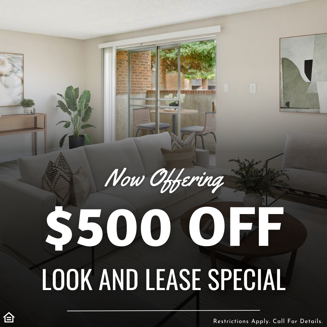 Modern apartment living room with sofa, coffee table, indoor plants, and sliding glass doors leading to a patio with seating. Promotional text overlay reads: 'Now Offering $500 Off Look and Lease Special.' Small print at the bottom says 'Restrictions Apply. Call For Details.' Equal housing logo in the corner.