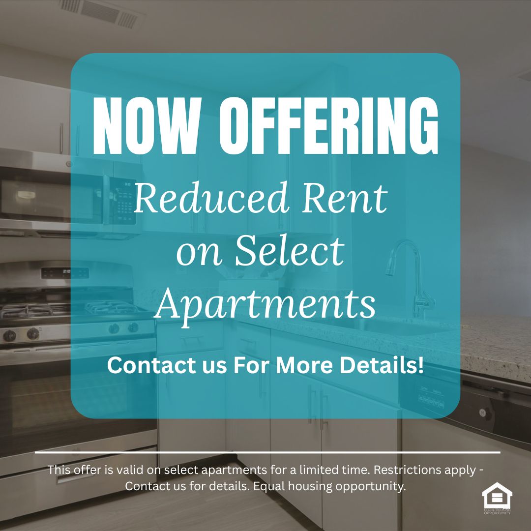 Modern kitchen featuring stainless steel appliances including a microwave and a gas stove The cabinets are sleek and white complemented by a granite countertop There is a sink with a modern faucet and a dishwasher Natural light illuminates the space highlighting the clean and contemporary design  The text reads now offering reduced rent on select apartments contact us for more details This offer is valid on select apartments for a limited time Restrictions apply contact us for details Equal housing oppo