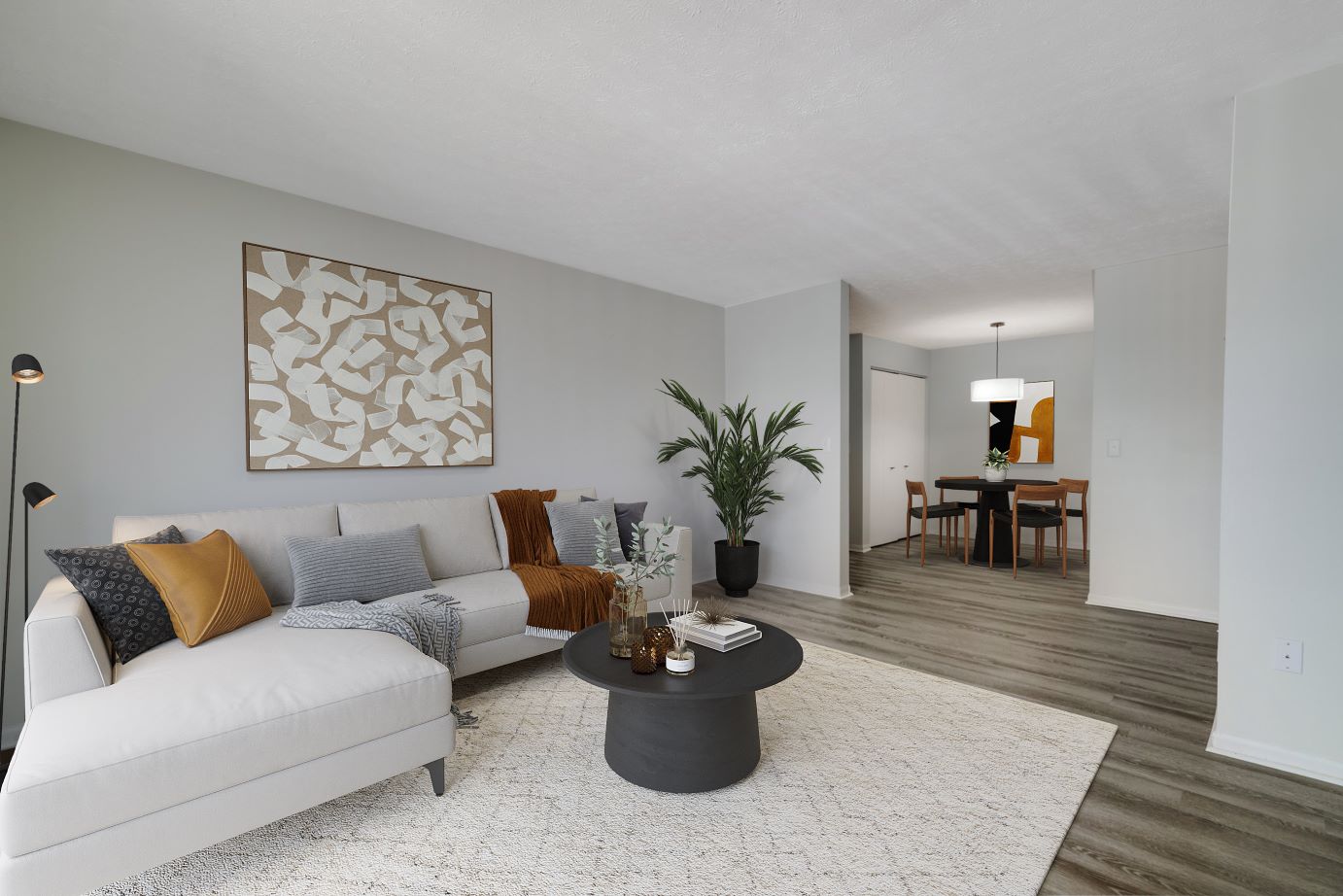 A living room with a couch and a table at Lakeview Apartments in Franklin, IN