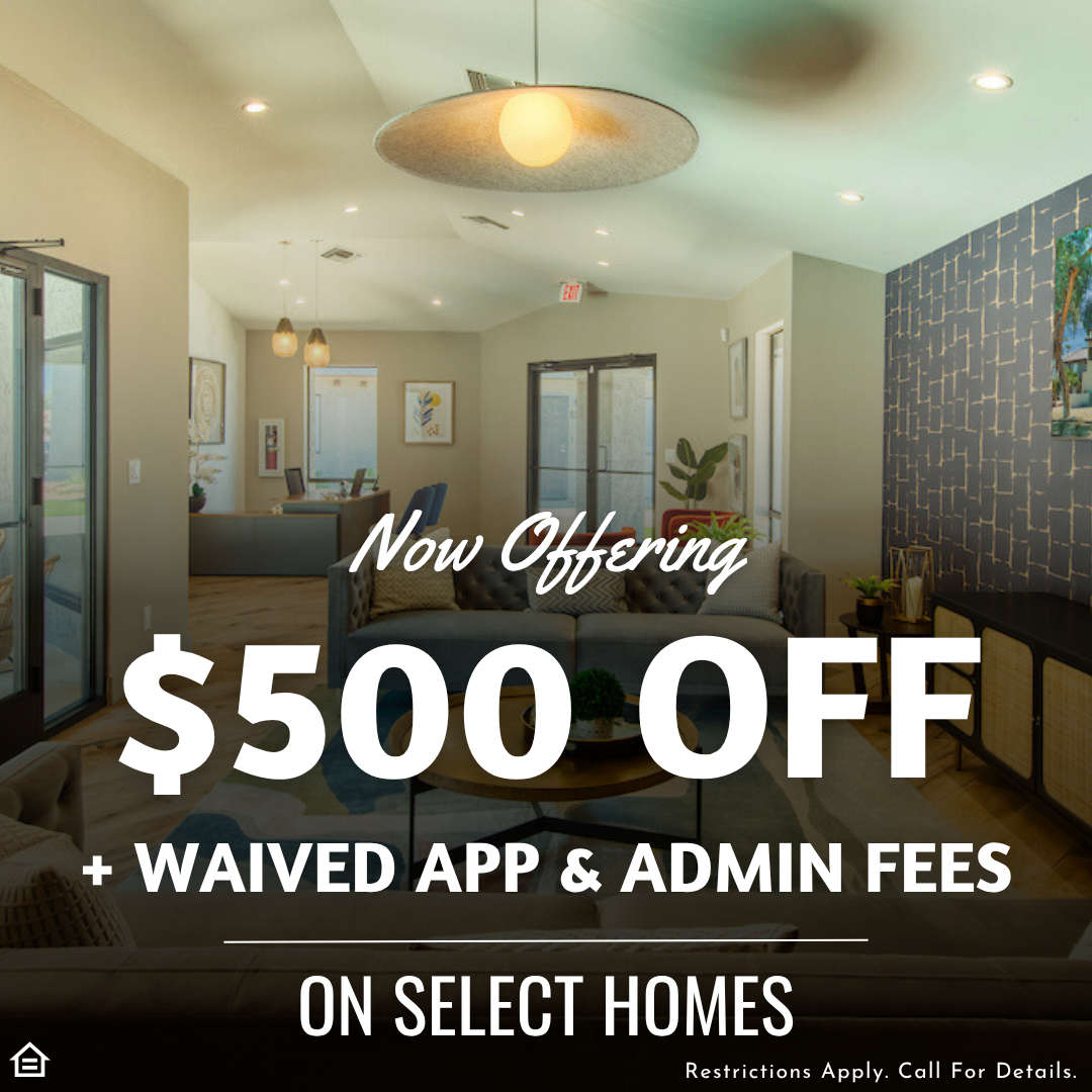 Interior view of a modern apartment community clubhouse with neutral walls, wood flooring, pendant lighting, and comfortable seating. Promotional text over the image reads “Now Offering $500 OFF + Waived App & Admin Fees on Select Homes.” Fine print at the bottom says “Restrictions Apply. Call For Details.”