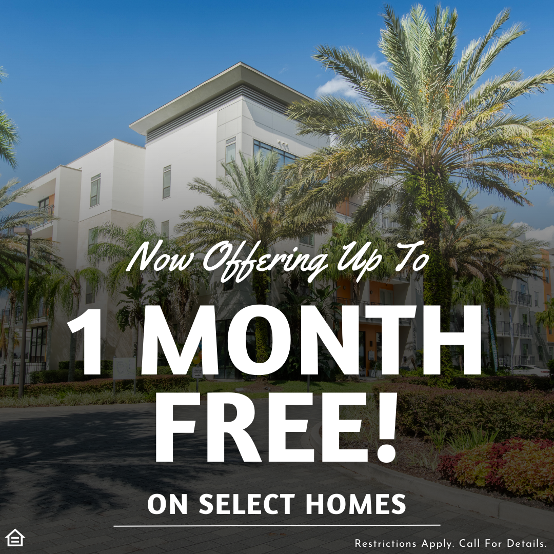 Promotional graphic featuring a sunny exterior view of a modern, multi-story apartment building with white and gray facades, surrounded by tall palm trees. Large, bold white script and block text overlaid on the image reads, 'Now Offering Up To 1 MONTH FREE! ON SELECT HOMES.' Fine print at the bottom states, 'Restrictions Apply. Call For Details.' located next to an Equal Housing Opportunity icon.