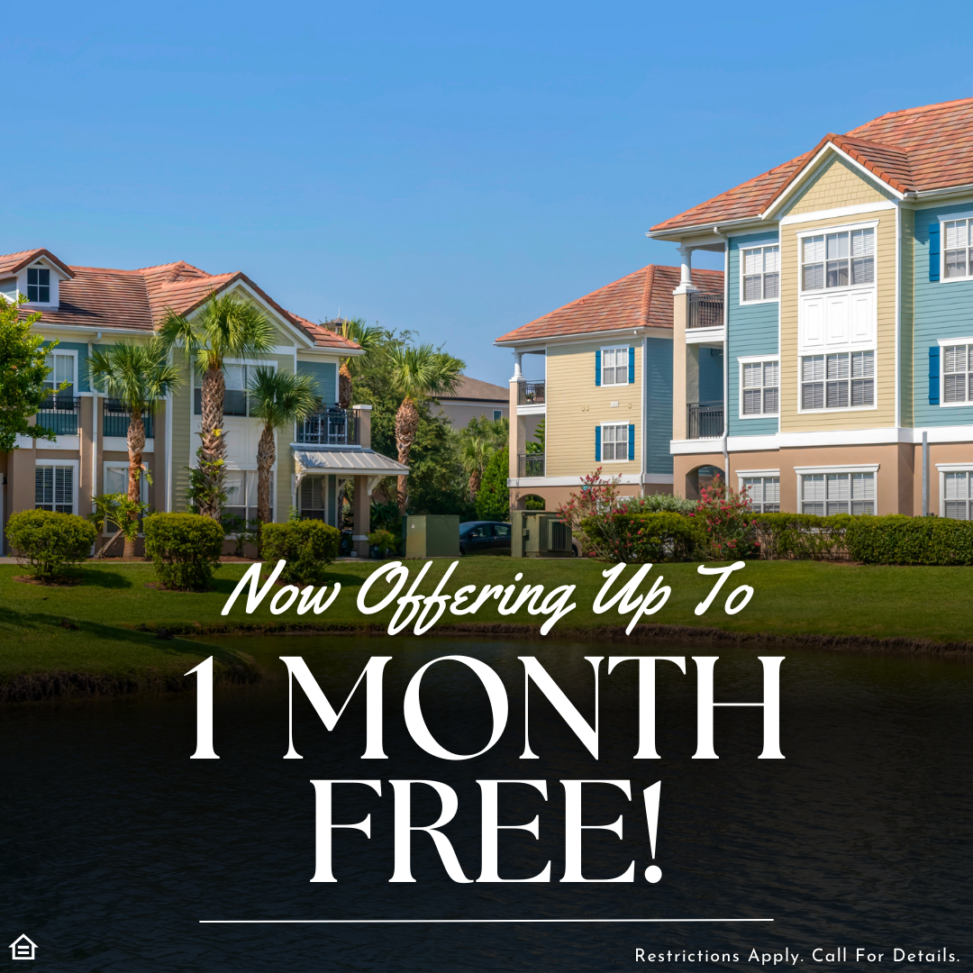 An image of a blue and yellow apartment community exterior with orange shingle roofing and nearby palm trees and grass with a pond. The text says "Now offering up to 1 month free! Restrictions apply. Call for details."