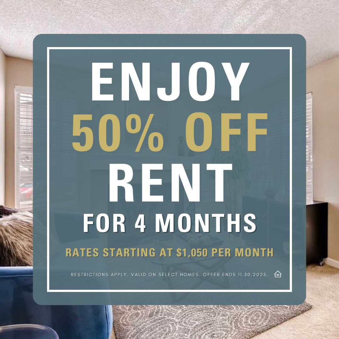 Promotional graphic for an apartment leasing special. The text reads “Enjoy 50% Off Rent for 4 Months. Rates starting at $1,050 per month. Restrictions apply. Valid on select homes. Offer ends 11.30.2025.” The background shows a bright living room with large windows, a gray area rug, and neutral-toned furniture.