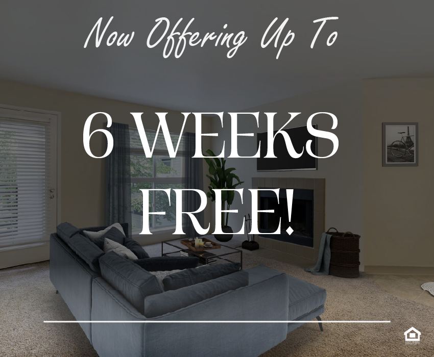 A cozy living room featuring a blue sectional sofa, a black coffee table, and a fireplace. The text on the image says, "Now offering up to 6 weeks free!"