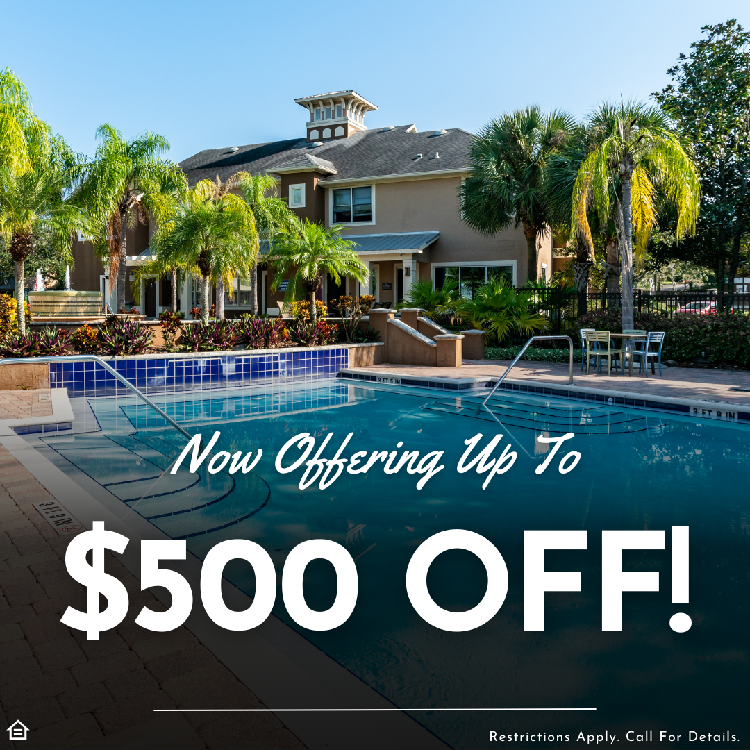 Photo of an apartment pool with palm trees and seating under a blue sky. Text reading, "Now offering Up To $500 off! Restrictions apply. Call for details."