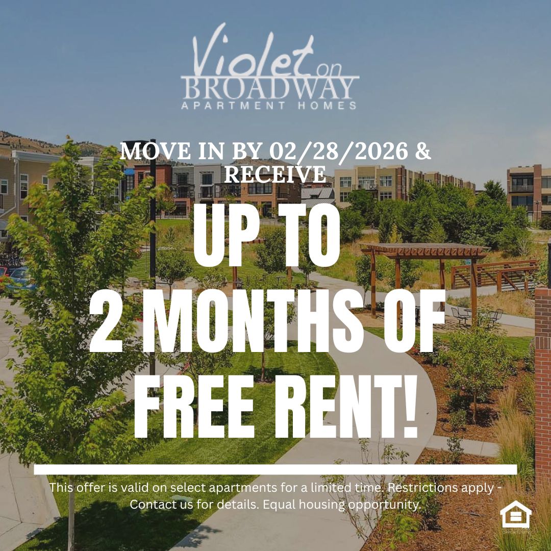 A modern residential neighborhood featuring multiple buildings with various architectural styles green lawns, trees, and pathways. The scene includes parked cars and a pergola in the foreground, with mountains visible in the background under a clear blue sky text reads move in by February 28th 2026 and receive up to 2 months of free rent This offer is valid on select apartments for a limited time Restrictions apply Contact us for details. Equal housing opportunity
