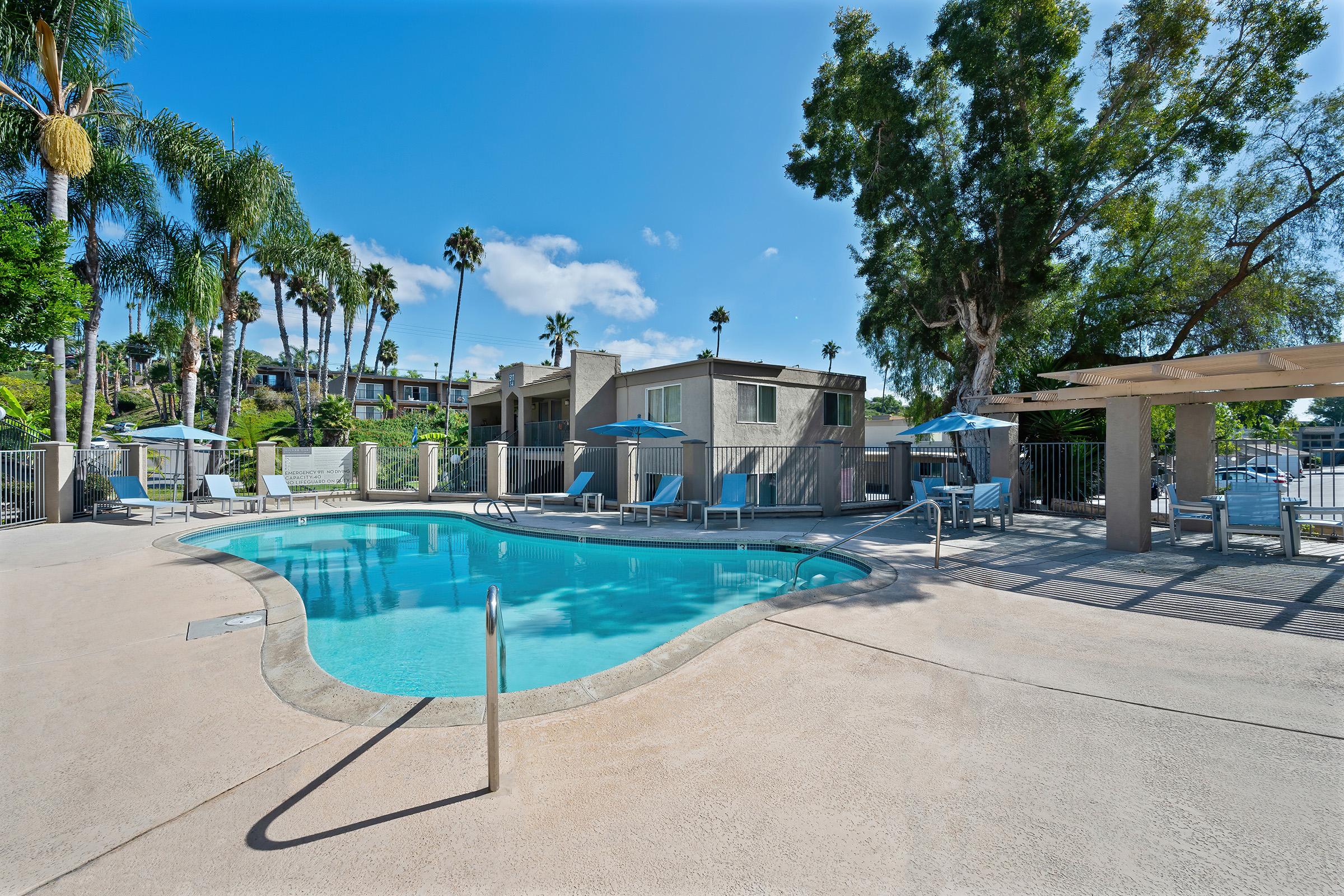 A promotional graphic stating Apply Today to Receive Up to 2000 OFF FIRST MONTHS RENT on Select Apartment Homes Limited Time Offer Restrictions May Apply Equal Housing Opportunity With a background of patio furniture with an umbrella