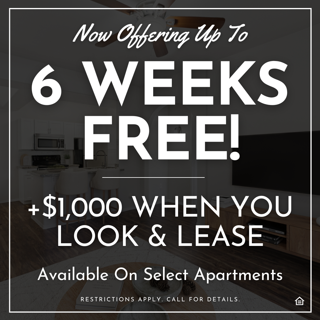 Promotional apartment ad with a dark transparent overlay showing a modern kitchen and living room. Large white text reads, “Now Offering Up To 6 Weeks Free!” and below it says “+$1,000 When You Look & Lease.” Smaller text at the bottom states “Available on Select Apartments” and “Restrictions apply. Call for details.” A small equal-housing icon appears in the bottom right corner.